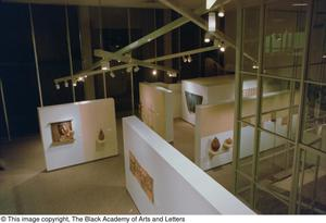 Aerial view of sculptures and paintings on display in gallery