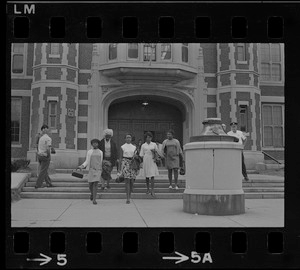Black women exiting East Boston High School during the time of student demonstrations