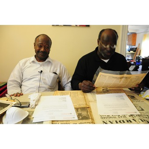 Stephen Hunter and David F. Hunter examine family artifacts