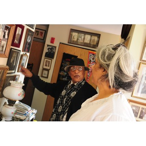 Reverend Chauncy Moore and Lolita Parker, Jr. discussing a photograph