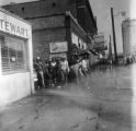 Firemen spraying civil rights demonstrators with a hose during the Children's Crusade in downtown Birmingham, Alabama.