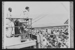 U.S. Negro troops on way to Liberia. Chaplain J.R.C. Pinn conducts a church service on the forward deck of a troop transport carrying a large contingent of U.S. Army engineers to Liberia, Africa, with which the United States has concluded a defense ageement. The Negro troops joined in singing hymns during the service