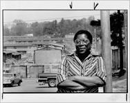 Eva Davis in front of East Lake Meadows apartments, September 8, 1986