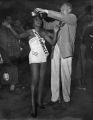 African American beauty queen being awarded the title of Miss Bronze by the Veterans of Foreign Wars (VFW) Post 289, Seattle, April 5, 1954