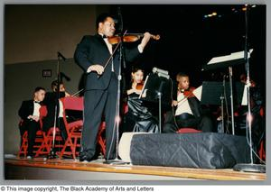 Thumbnail for Photograph of a student performing a violin solo