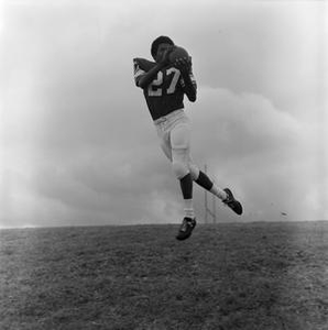 NTSU football player jumping, 5