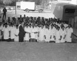 Employees outside the Poultry Products Company at 527 South Decatur Street in Montgomery, Alabama.