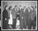 Group photograph featuring African-American men receiving presentation, Los Angeles, ca. 1951-1960