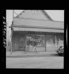 Detroit, Michigan. Sign in a grocery window in the Negro district: "chitlins and hogjaws"