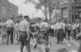 Thumbnail for Police dog attacking Walter Gadsden, a student at Parker High School, during a civil rights demonstration in downtown Birmingham, Alabama.