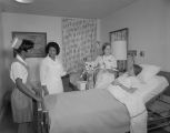 Gail Estes, a ventilation therapist, explaining a mechanical respirator to a patient at Jackson Hospital on Forest Avenue in Montgomery, Alabama.