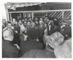 Richard J. Daley in front of a "We Care" campaign office