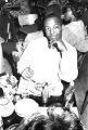 Robert Flowers seated at a table at the Laicos Club in Montgomery, Alabama, during a performance by the Sheiks.