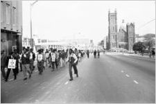 Protest march during the Atlanta sanitation workers strike, the Shrine of the Immaculate Conception (48 Martin Luther King, Jr. Drive SE) is in the background to the right, Atlanta, Georgia, April 13, 1970