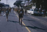 Marching band performing during a homecoming parade down Highland Avenue in Montgomery, Alabama.