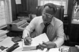 Alex Haley: Seated at desk (AHP 1-79-11 #63)