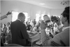 Martin Luther King, Jr., speaking to an audience in a church building, probably First Baptist Church in Eutaw, Alabama.