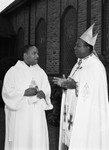 Bishop and clergy member talking outside of the Church of the Advent, Los Angeles, 1984