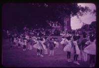 Students dressed in white gathered outside for a May Day celebration - African American Schools 2