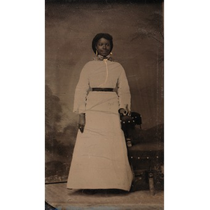 An African American woman in a white dress