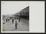 Time out for exercising. Each segregation train, when possible, paused for 10 or 15 minutes at some railroad siding to allow the passengers to detrain and limber up. Photographer: Mace, Charles E