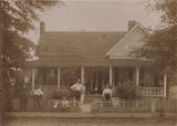 George Reynolds and family standing in front of their home in Clayton, Alabama.