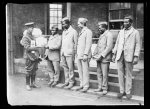 The negro soldier in the American section of the Fourth Scottish General Hospital at Glasgow is inclined to regard the little Red Cross safety razor as a thing to smile about, while the man at the end of the line is almost suspicious of the new-fangled apparatus. "Sho, boss, I never can shave with anything that ain't got no more edge than dat", he declares