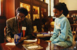 Gwendolyn Brooks signing a book