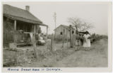 African Americans in front of house