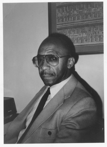 Bernard W. Bell, sitting indoors