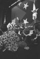 George Wallace speaking on stage at a rally in the Municipal Auditorium in Birmingham, Alabama, during Lurleen Wallace's gubernatorial campaign.