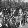 Martin Luther King Jr. standing among marchers at a rest stop on Highway 80 in Dallas County, Alabama, on the first day of the Selma to Montgomery March.