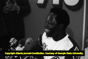 Hank Aaron fielding questions at a press conference after breaking the home run record, 1974