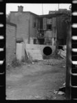 [Untitled photo, possibly related to: Front of Negro home near Capitol, Washington, D.C. Interiors of these homes vary little. A chair or two and a table, a bed and perhaps an extra mattress on the floor cares for six to ten people]