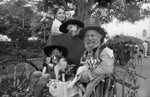 Blessing of the Animals participants posing in a cart, Los Angeles, 1982