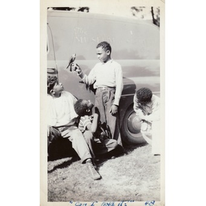 Boy holds a small falcon in his hand