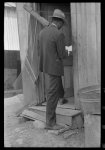 [Untitled photo, possibly related to: Negro Preacher reading the scriptures to Negro man, San Antonio, Texas]