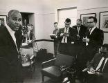 Roy Wilkins speaks to the press