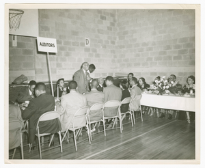 Photograph of a man speaking at an Atlanta Life Insurance Company reception