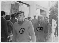 Mississippi State Sovereignty Commission photograph of Tougaloo College students Charles Haynes and Abraham Gates (left to right) standing in front of a Western Union storefront during an Anti-Vietnam War demonstration protesting Secretary of Defense Robert McNamara's visit to Jackson, Mississippi, 1967 February 24