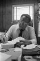 Alex Haley: Seated at desk (AHP 1-79-11 #63)