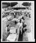 Thumbnail for Thousands of signs to be carried in the March on Washington 8/28 are being prepared by workers in front of the headquarters tent set up on the Washington Monument grounds 8/27