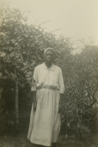 Gullah woman standing by trees