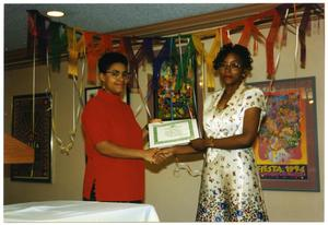 Woman in Red Presenting Award to D'Shandra Walker