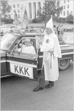 Two Klansmen at car during a Ku Klux Klan rally in Montgomery, Alabama.