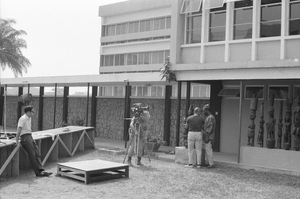 Eliot Elisofon and cameraman George Bracher filming renowned woodcarver Lamidi Olonade Fakeye, Ibadan, Nigeria