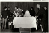 Photographs of Sammy Davis, Jr. presented with a birthday cake, December 1960