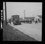 Detroit, Michigan. Riot at the Sojourner Truth homes, a new U.S. federal housing project, caused by white neighbors' attempt to prevent Negro tenants from moving in. Back view of typical newspaper photographer