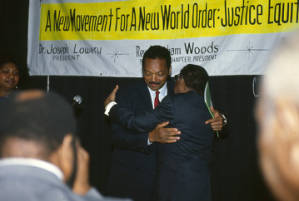 Jesse Jackson hugging Joseph Lowery at the annual meeting of the Southern Christian Leadership Conference (SCLC) in Birmingham, Alabama.