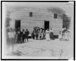 [African Americans standing outside of a church]